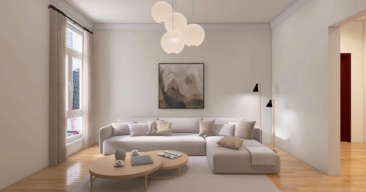 Bright living room with a sectional sofa, round coffee tables and pendant lights