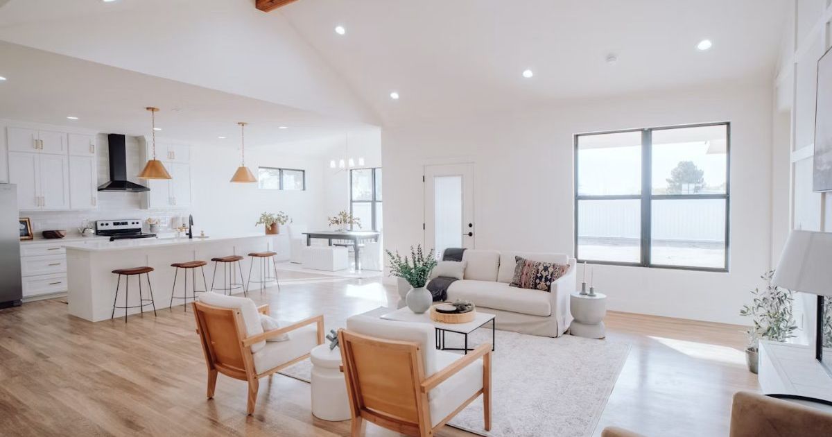 Bright living room with a sectional sofa and pendant lights