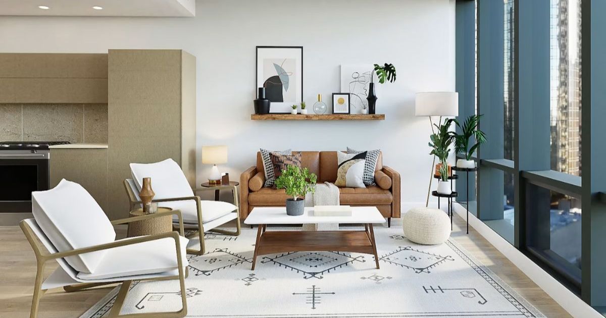 Living room in warm neutral tones with armchairs, a sofa and a large window