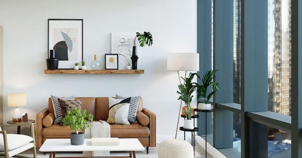 Living room with a leather sofa, plants and floor-to-ceiling windows