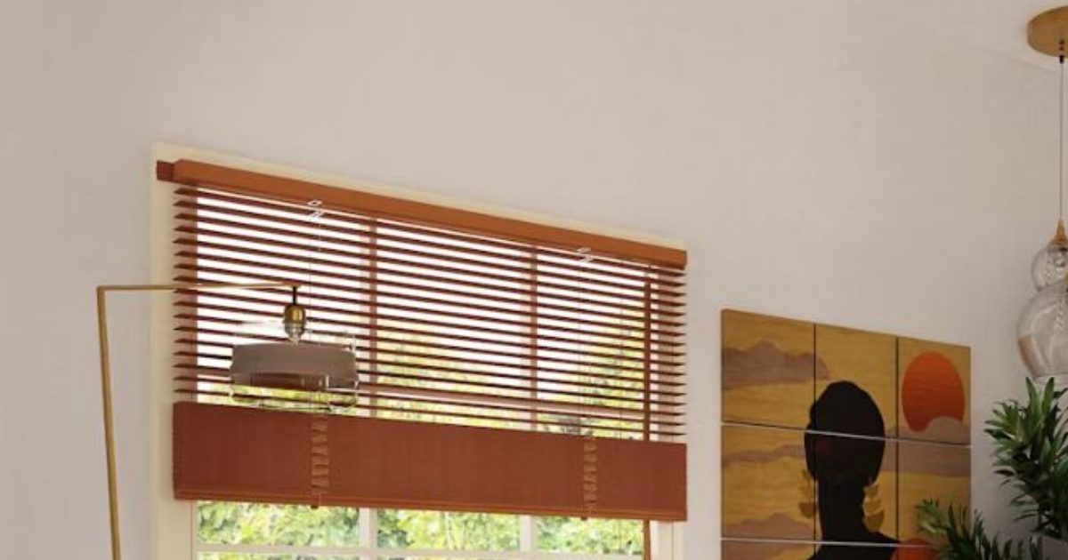 Wooden window blinds beside a floor lamp and a framed artwork on a white wall